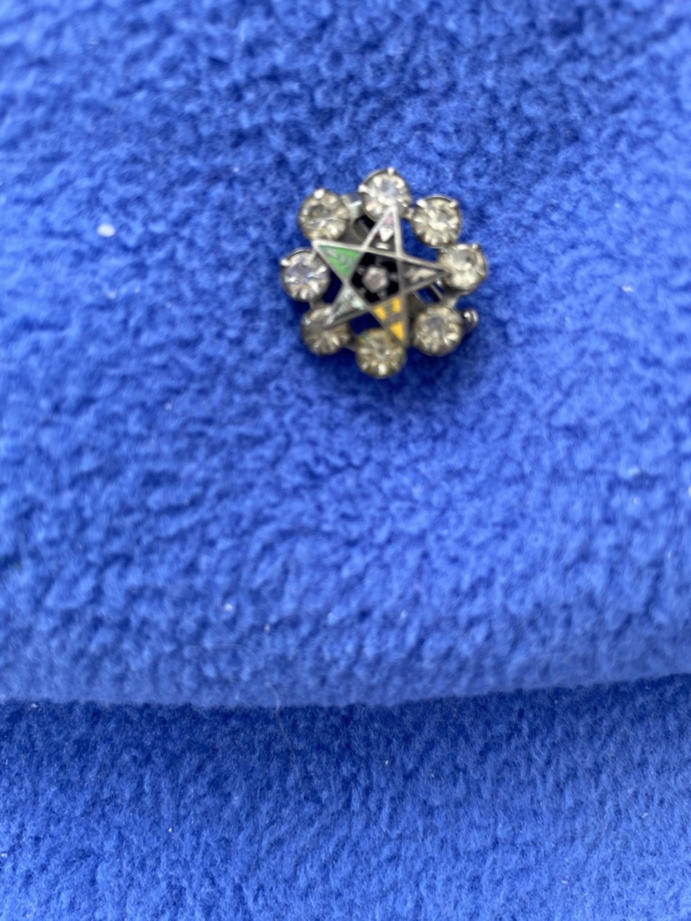Vintage eastern star pin eight rhinestones in one eastern star in the middle.